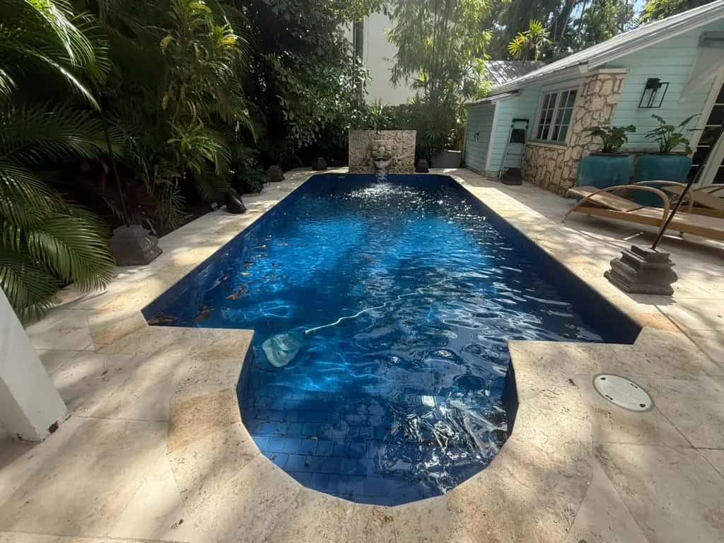 Travertine pool deck restored after pressure cleaning