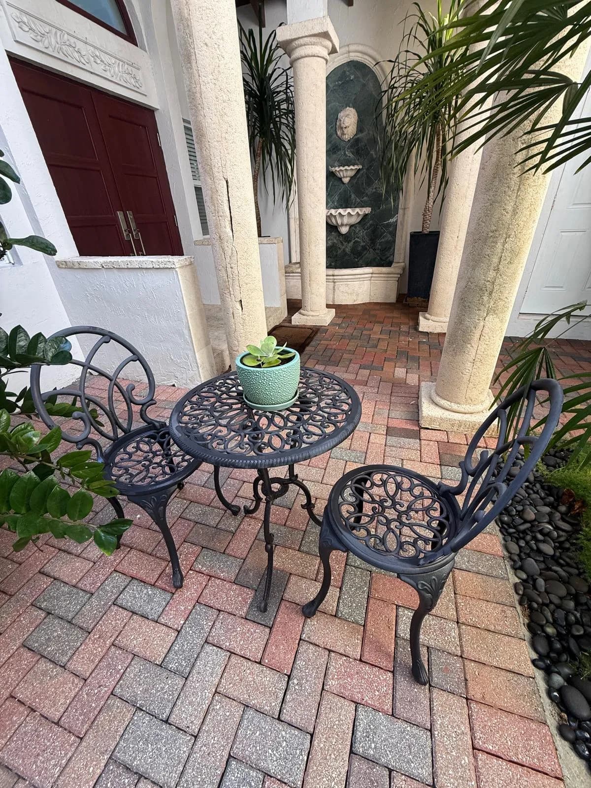 Herringbone paver entry patio with bistro set after cleaning — Looking New, serving North Lauderdale