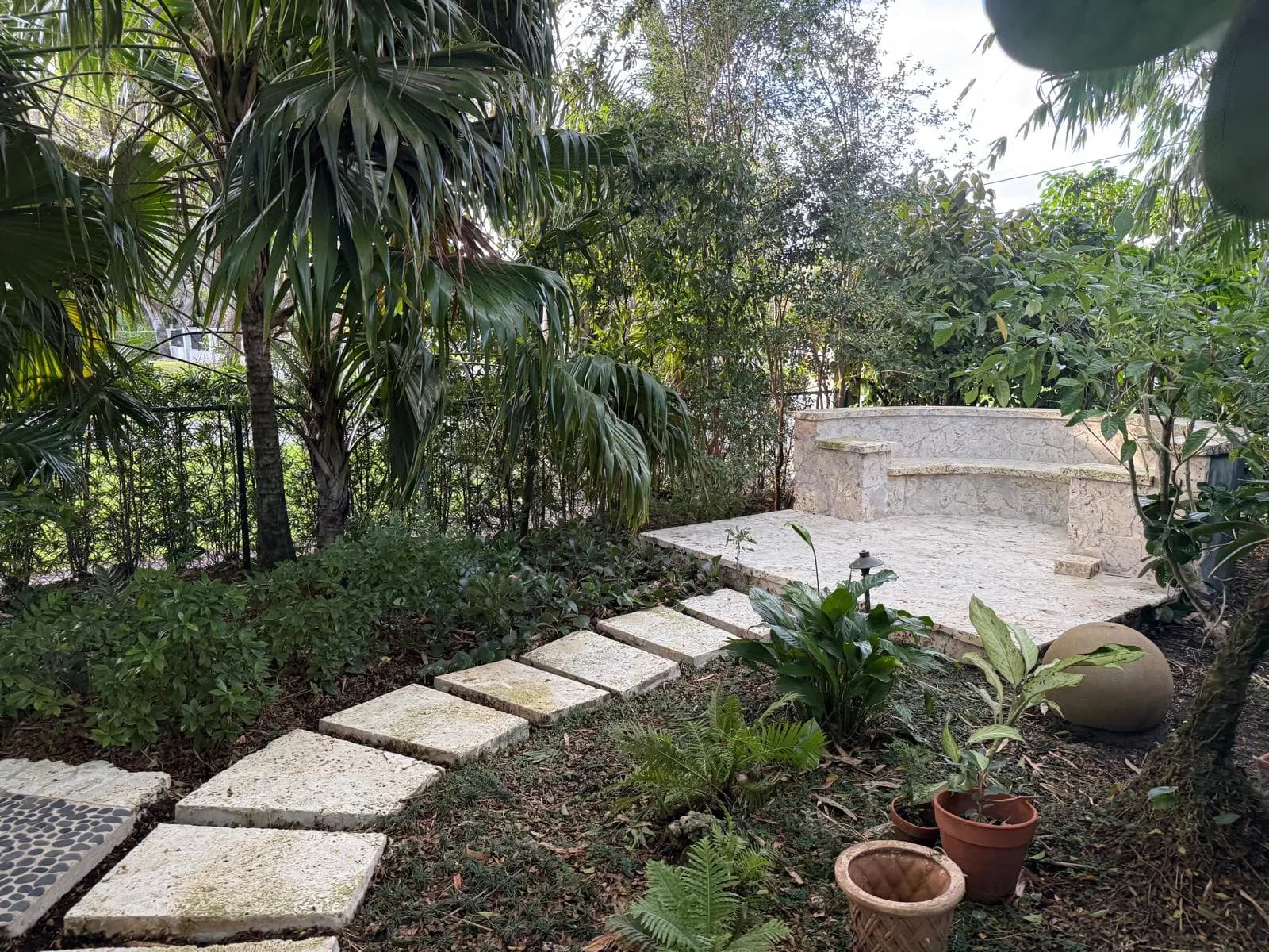 Coral stone stepping stones and bench after cleaning — Looking New, serving Cooper City