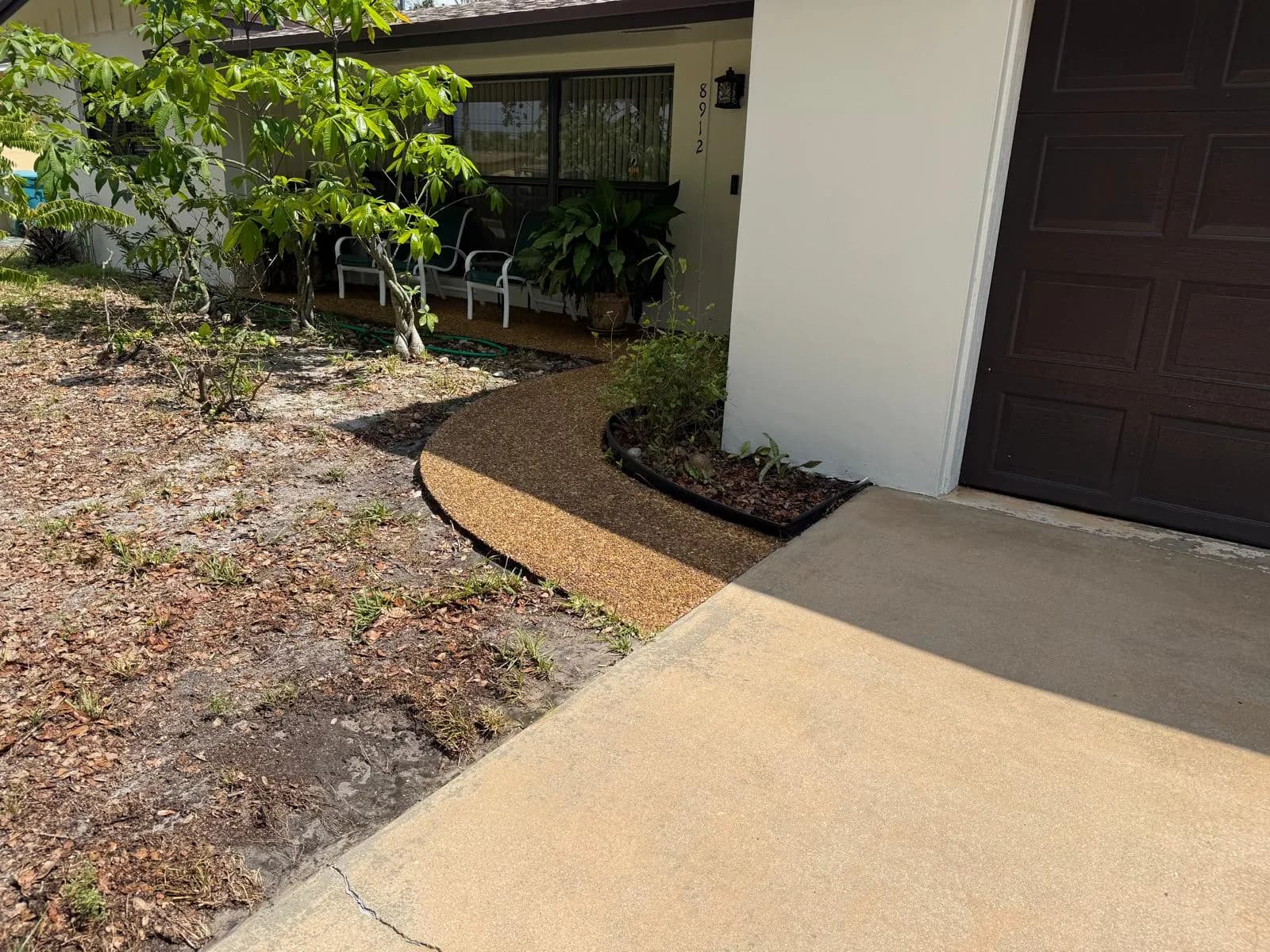 Clean driveway and new edged mulch bed after the refresh — Looking New, serving Southwest Ranches
