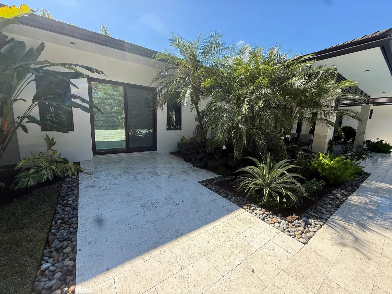 Bright travertine entry walkway after pressure cleaning — Looking New, serving Parkland